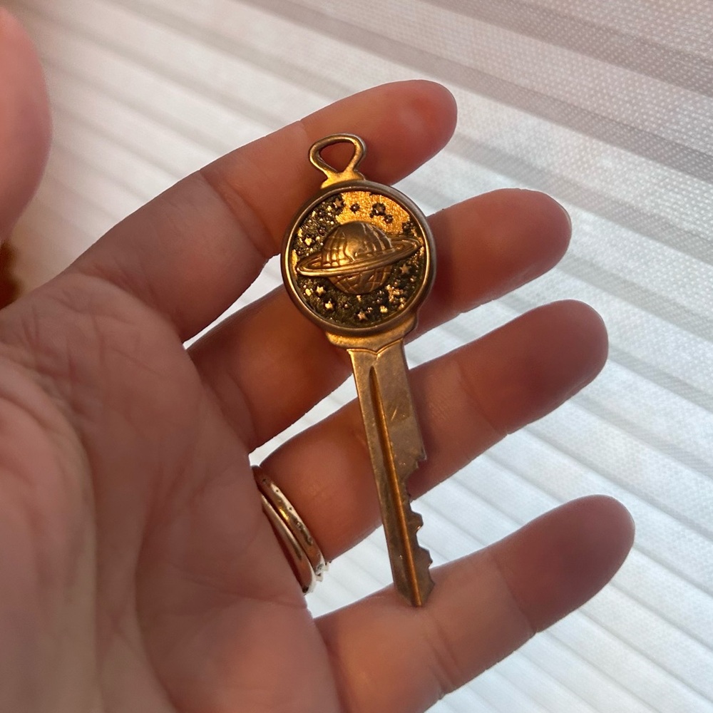 Gold Planet Key Pendant